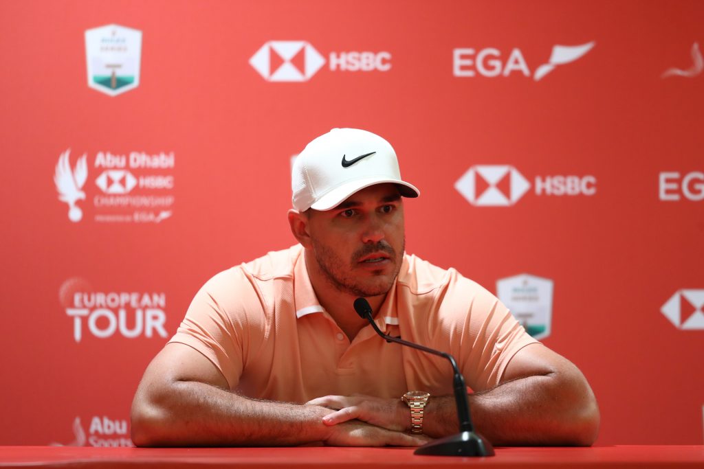 BROOKS KOEPKA talks to reporters during practice at the 2020 Abu Dhabi HSBC Championship