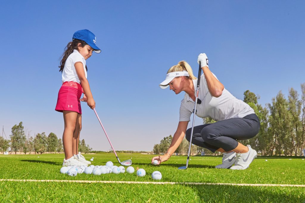 Ladies European Tour pro Amy Boulden teaching a young Saudi girl at Royal Greens Golf & County Club, in King Abdullah Economic City, near Jeddah