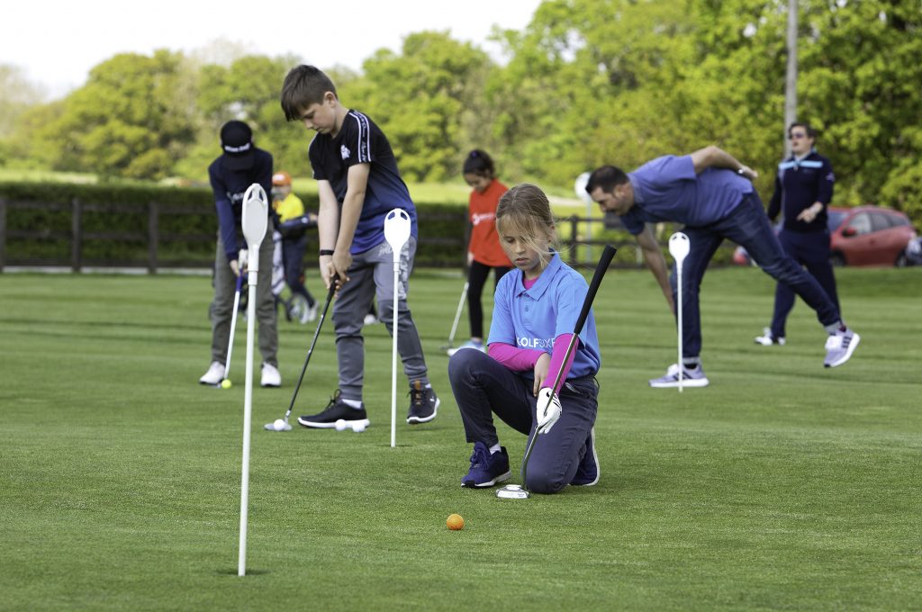 Youngsters practising before a GolfSixes League match